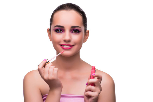 Nainen soveltamalla huulipunaa eristetty valkoinen
 - Valokuva, kuva
