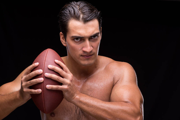 Ripped muscular man with american football - Foto, Bild