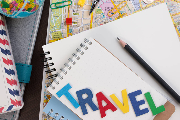 Travel planning with travel word alphabet. Template with planning items on traveler workplace. - Zdjęcie, obraz