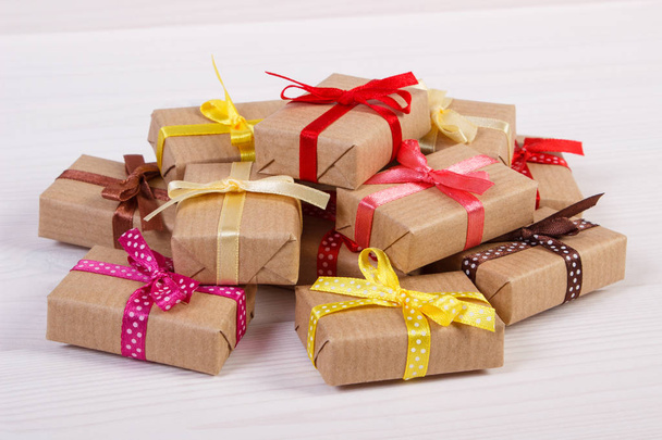 Wrapped gifts with colorful ribbons for Christmas or other celebration - Zdjęcie, obraz