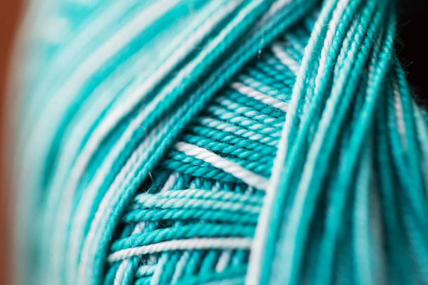 close up of turquoise knitting yarn ball - Foto, afbeelding
