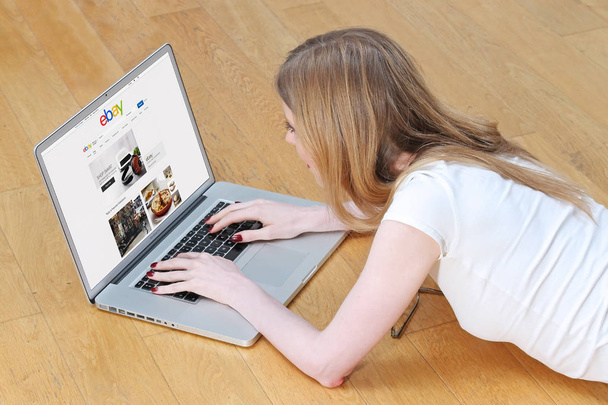 Girl on Ebay laptop - 写真・画像