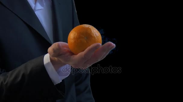 Weighing Orange in Hand - Footage, Video