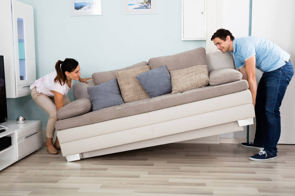 Couple Placing Sofa - Zdjęcie, obraz