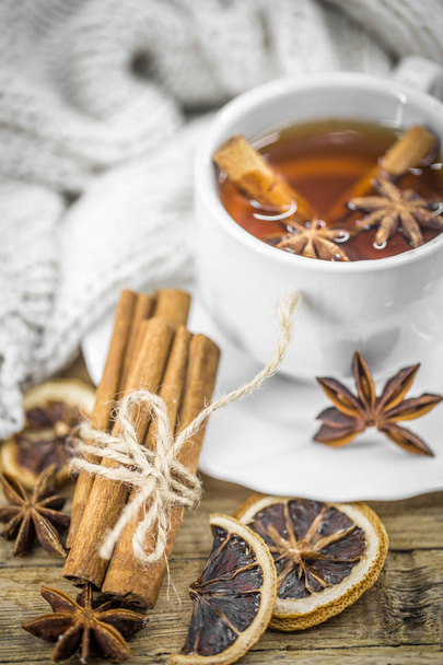 Cup of hot tea with lemon, a cinnamon stick - Photo, Image