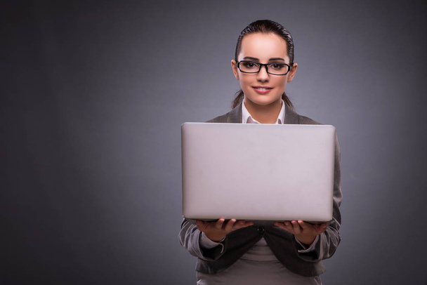 Businesswoman with laptop in business concept - Photo, Image