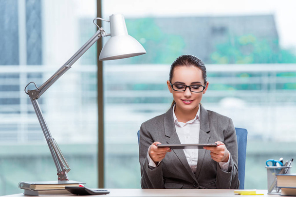 Businesswoman working with tablet computer in business concept - Фото, зображення