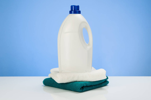 Cleaning or laundry product concept blue gradient background with accessories - Fotografie, Obrázek
