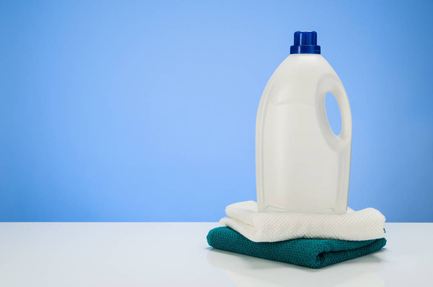 Cleaning or laundry product concept blue gradient background with accessories - 写真・画像
