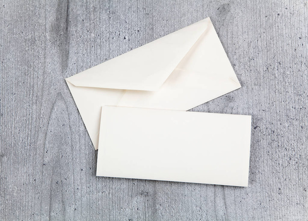 Envelope and card on wood background - Photo, Image