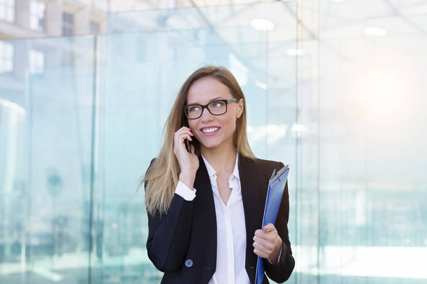 Portrait of a businesswoman talking on mobile phone - Fotó, kép