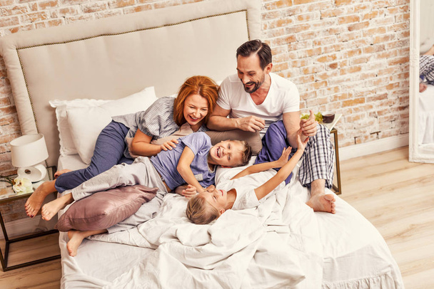 Young family being playful at home - Foto, Imagem