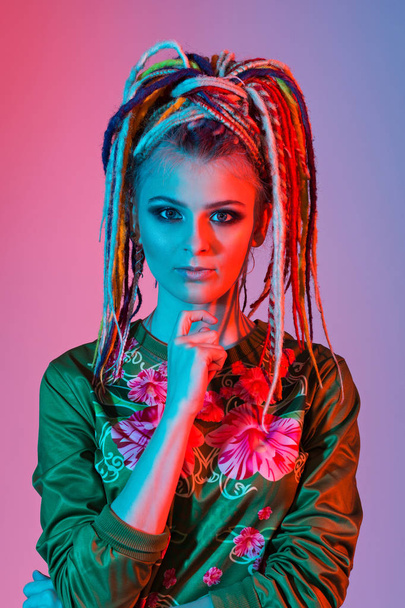 Beautiful woman with bright colors dreadlocks - Фото, зображення