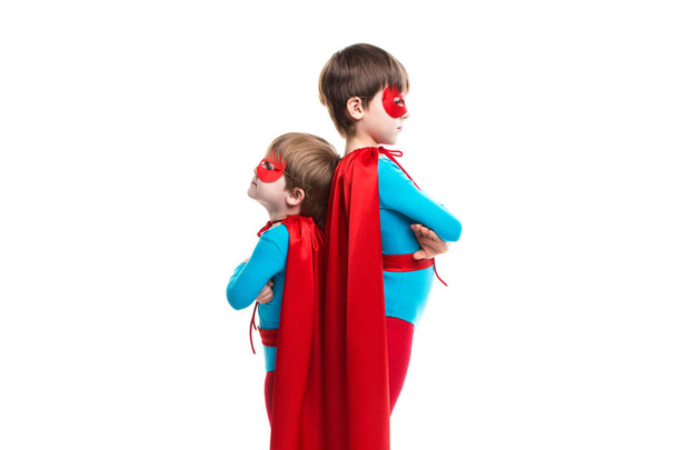 Two boy superhero with a mask and cloak. - Valokuva, kuva