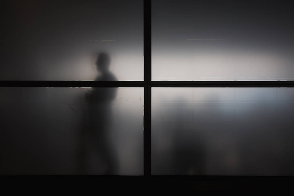 Silhouette of man behind matted glass - Photo, Image