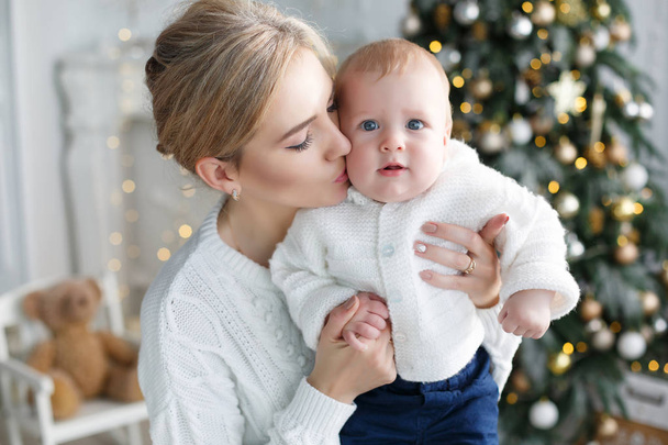 Portrait of happy mother and adorable baby celebrate Christmas. - Fotoğraf, Görsel