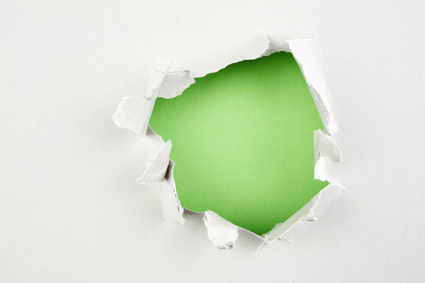 green hole in paper - 写真・画像