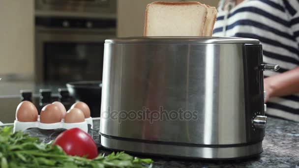 Roasted toast bread popping up from toaster slow motion - Footage, Video