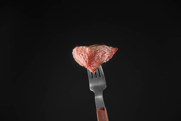 Fork with delicious steak piece  - Fotografie, Obrázek