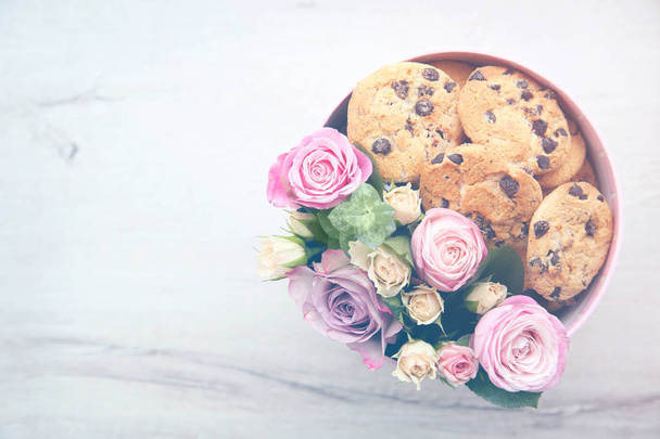 Box with beautiful flowers and cookies  - Foto, Imagem