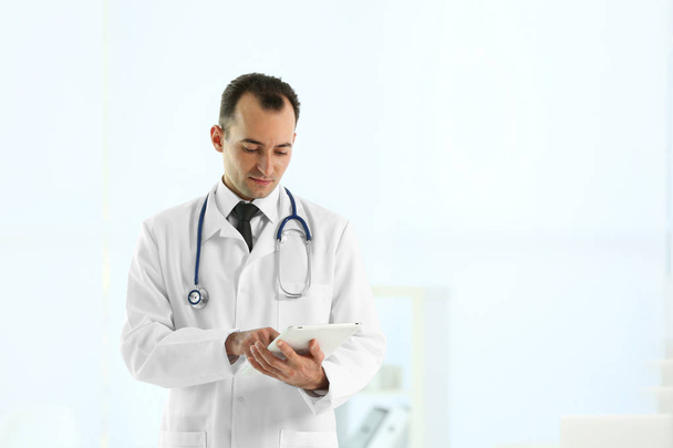 Doctor with tablet at hospital - Photo, image