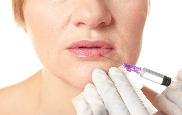 Procedure of lips augmentation - Photo, image