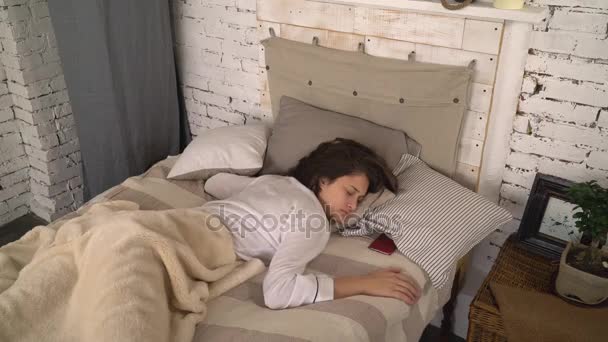 Female in the morning wake up and use mobile phone. - Footage, Video