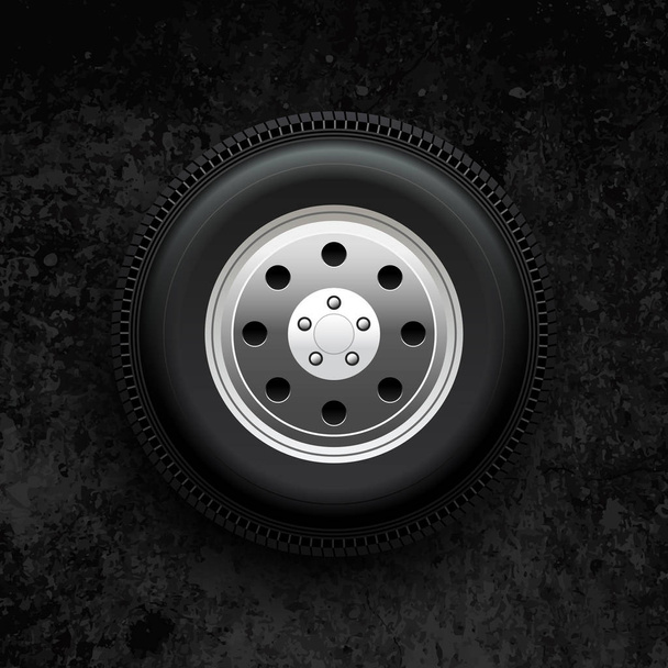 Car wheel on a black stone - Vector, Image