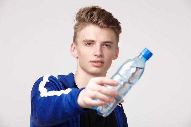 Young male athlete with water bottle  - Foto, Imagem