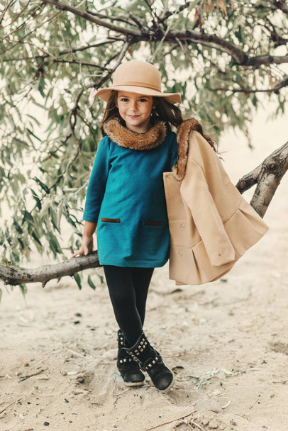 little girl in a hat with long hair - Zdjęcie, obraz