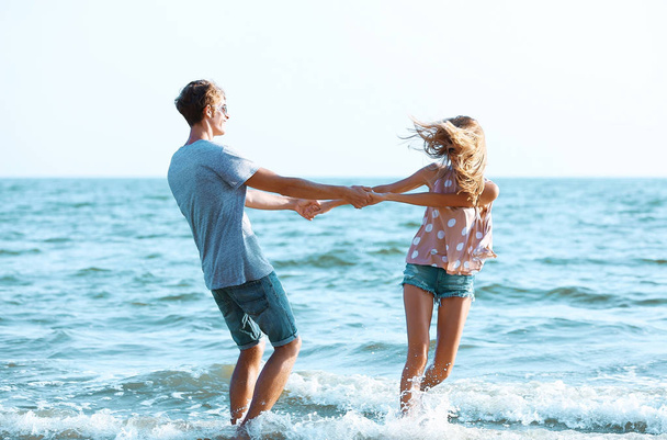 couple playing in sea - Foto, imagen