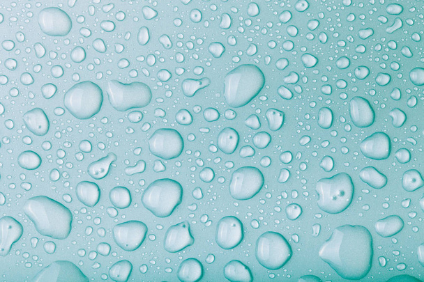 Gotas de agua sobre un fondo de color. Azul. Tonificado - Foto, Imagen