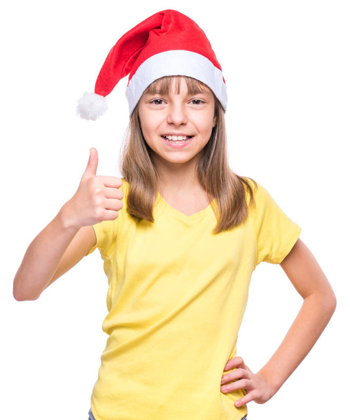 süßes Mädchen mit Weihnachtsmann-Hut - Foto, Bild