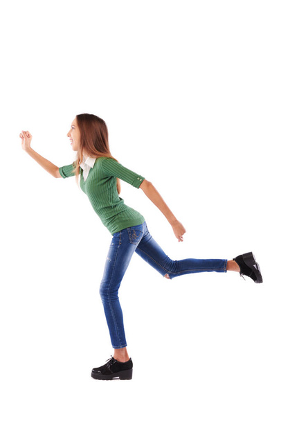 Enérgico e esportivo adolescente com pressa correndo para a frente sobre w
 - Foto, Imagem