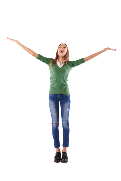 Portrait of a cheerful Caucasian teenager with hands raised poin - Φωτογραφία, εικόνα