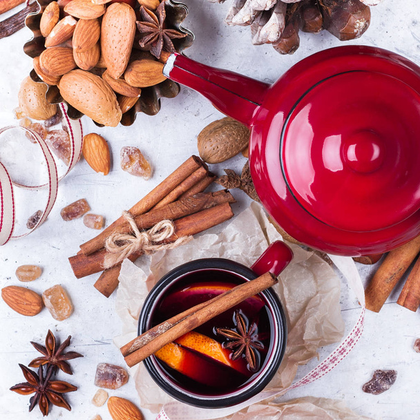 Hot mulled wine in a red mug for winter holidays - Photo, Image
