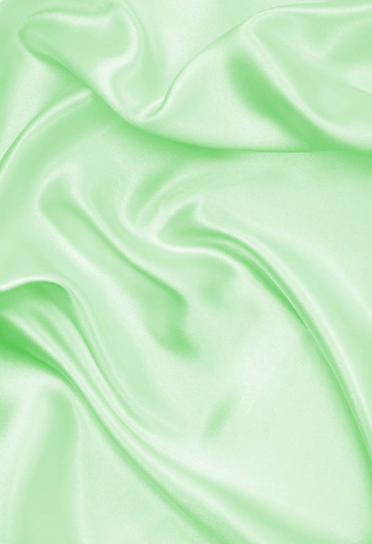 Smooth elegant green silk or satin luxury cloth texture as abstr - Photo, Image