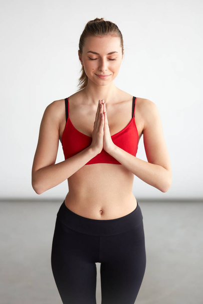 Young woman doing yoga - Valokuva, kuva