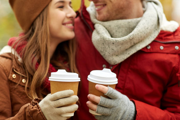 close up of happy couple with coffee in autumn - Zdjęcie, obraz
