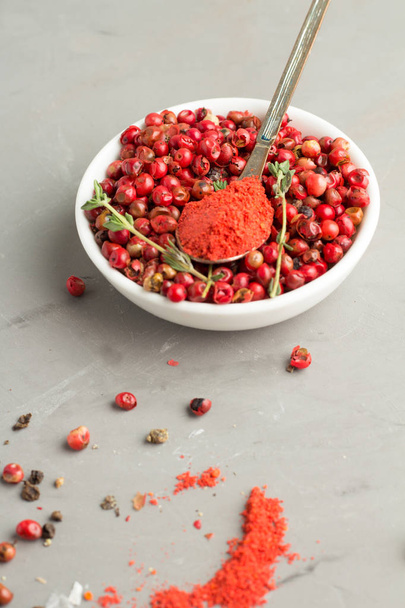pink pepper and red pepper on the spoon - Photo, Image