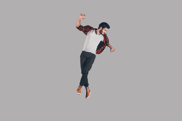stylish man hovering in air - Foto, afbeelding