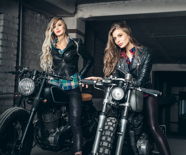 Bikers women in leather jackets with motorcycles - Foto, afbeelding