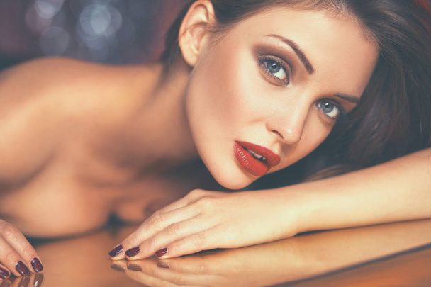 Portrait of beautiful girl with trendy makeup lying - Foto, Imagem