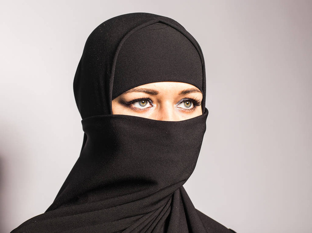 Young woman wearing niqab on background - Zdjęcie, obraz