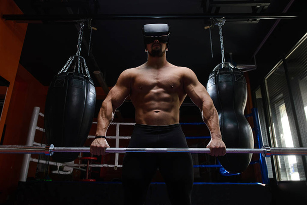 Fit man with VR headset - Foto, imagen