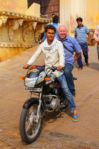 AMBER, INDIA - NOVEMBER 13: Unidentified people ride motorbike f - Fotó, kép