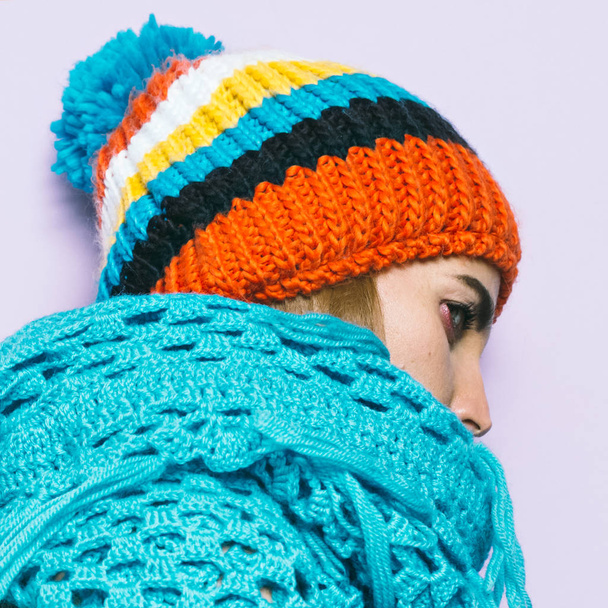 Girl Pom pom hat and knitted scarf. Warm fashion accessories - Zdjęcie, obraz