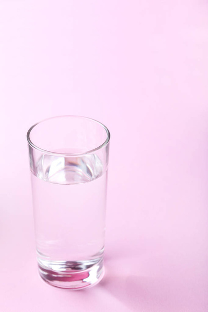 Glass with water on  background - 写真・画像