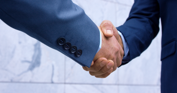 Businessmen shake hands - Filmati, video