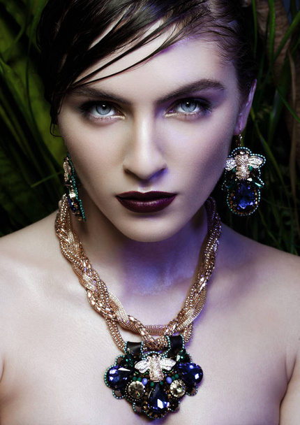 Beautiful woman wearing exotic tropical jewelry - Zdjęcie, obraz